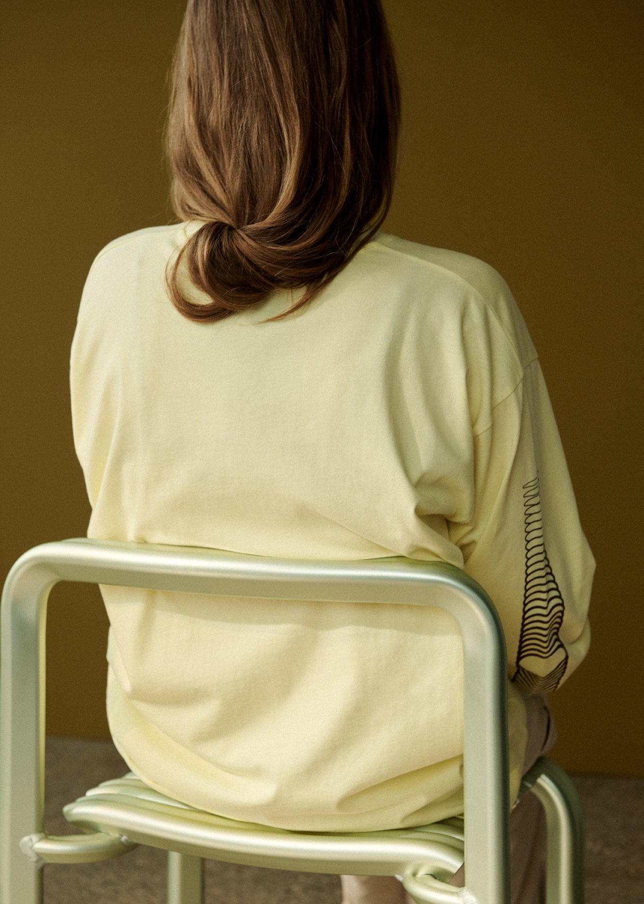 /cdn-cgi/image/width=1500,quality=85,format=auto/globalassets/content-media/images/20-year-and-3days/close-to-heart/next-chapters-close-to-heart-chair-longsleeve-tee-yellow-low-res.jpg