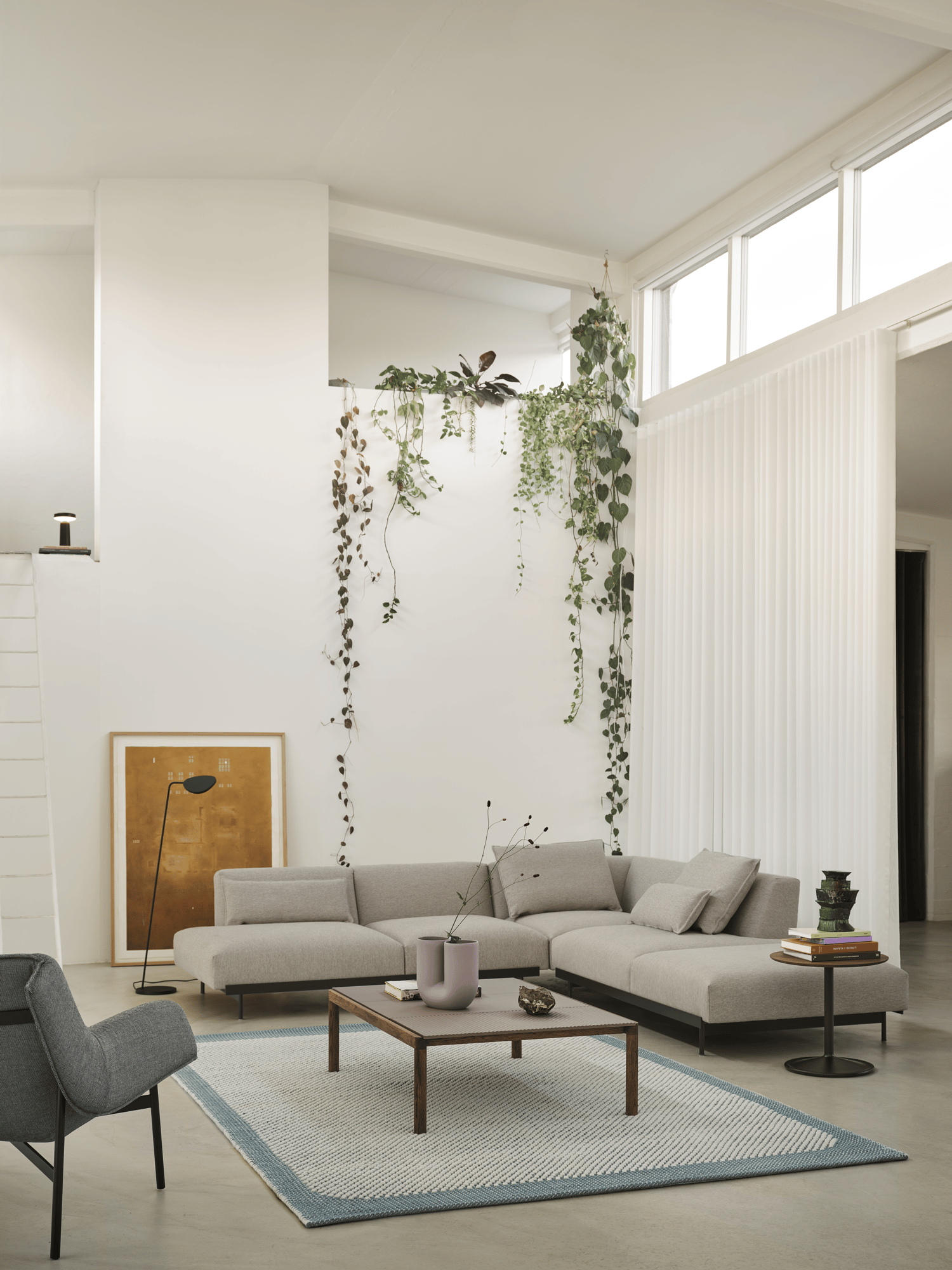 /cdn-cgi/image/width=1500,quality=85,format=auto/globalassets/content-media/images/plp/lighting/floor-lamps/in-situ-corner-config-4-clay-12-pebble-200x300-pale-blue-couple-coffee-table-120x84x35-2-plain-1-wavy-taupe-dark-oiled-oak-wrap-lounge-sabi-151-black-muuto-org.png