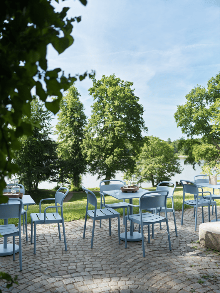 linear-steel-cafe-table-73-armchair-side-chair-pale-blue-platform-tray-raise-carafe-glass-muuto-org