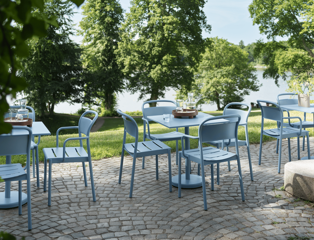 linear-steel-cafe-table-73-armchair-side-chair-pale-blue-raise-carafe-glass-platform-tray-muuto-org